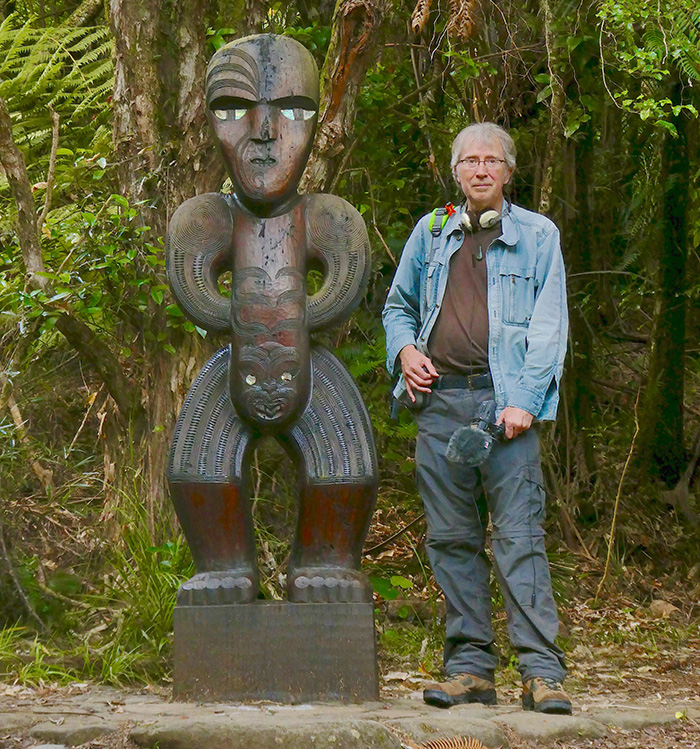 Clive Williamson with a Maori statue.